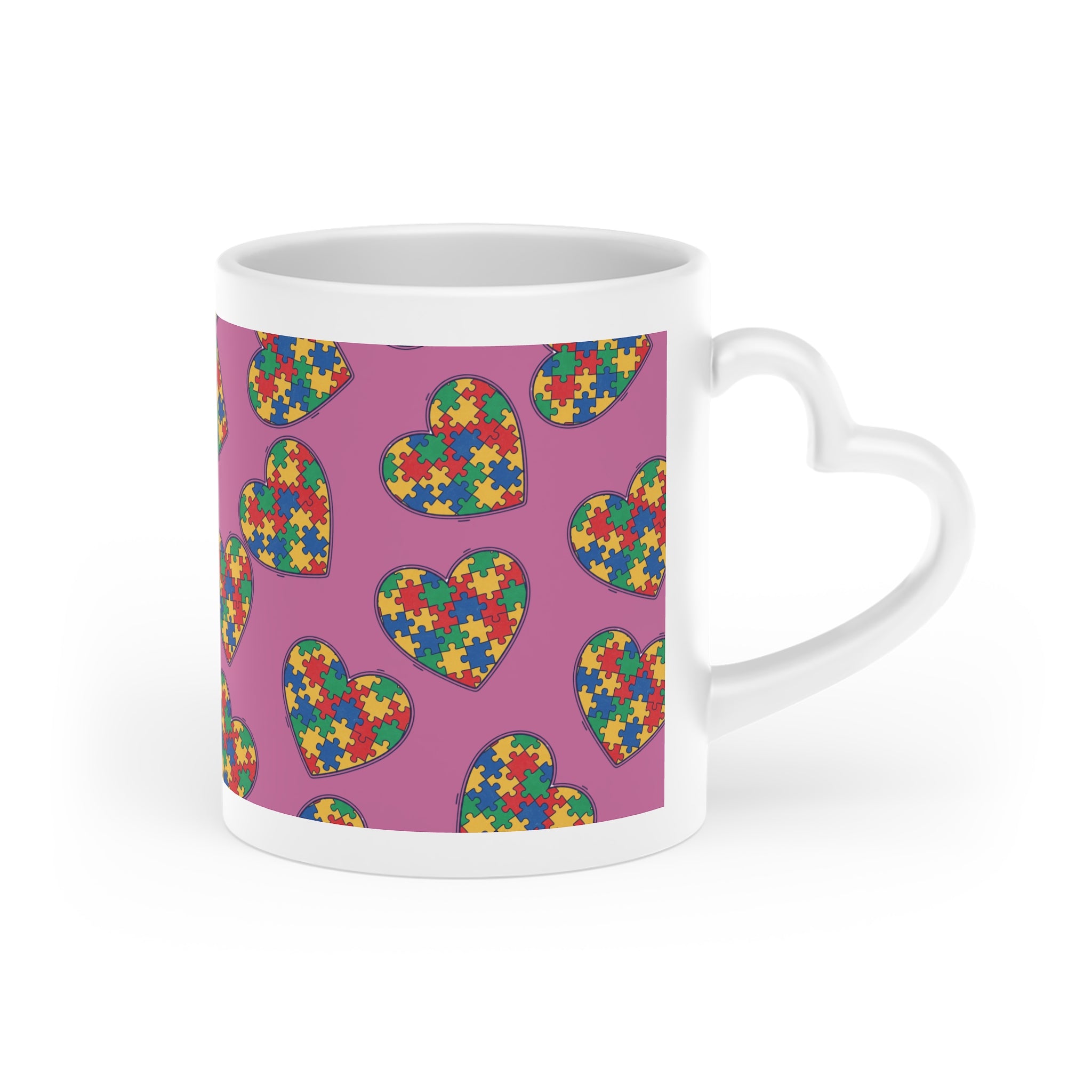 Autism Puzzle Heart Mug — Colorful Love Coffee Cup (Pink Background)