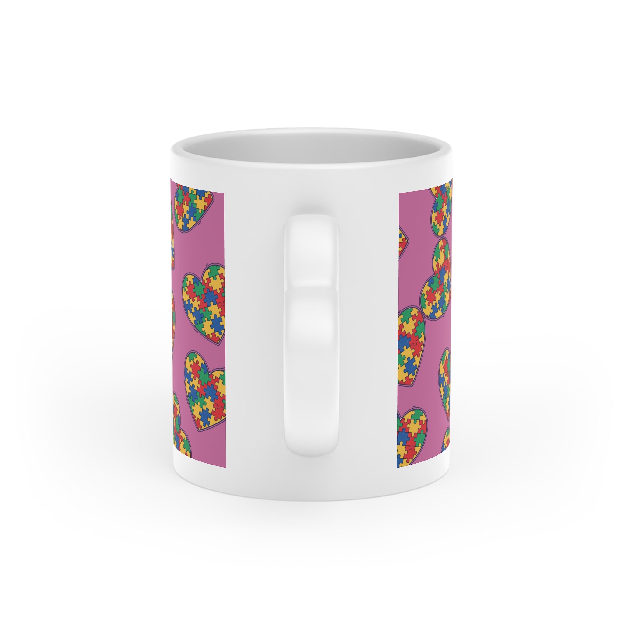 Autism Puzzle Heart Mug — Colorful Love Coffee Cup (Pink Background)