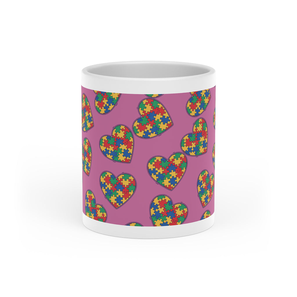 Autism Puzzle Heart Mug — Colorful Love Coffee Cup (Pink Background)